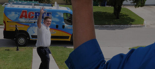 Acree Plumbing technician waving to a happy customer