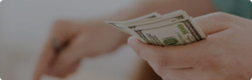 Person holding and counting money