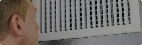 Person inspecting air ducts