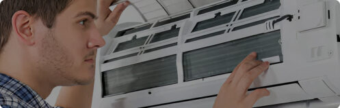 Resident inspecting their ductless hvac system in Tampa, FL