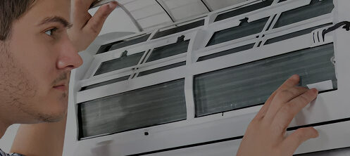 Resident inspecting their ductless hvac system in Tampa, FL