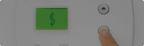 Thermostat displaying a dollar sign