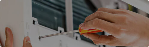 HVAC technician repairing a mini split unit