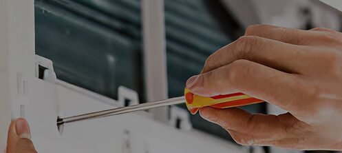 HVAC technician repairing a mini split unit
