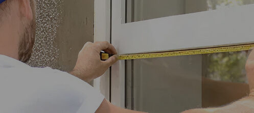 Installer measuring a window in Tampa FL