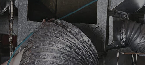 Technician working on air ducts in Tampa, FL