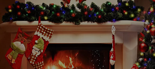 Holiday mantle with Christmas stockings over a fireplace