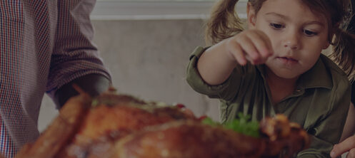 Family enjoying a turkey Thanksgiving dinner