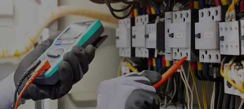 Electrician checking electrical boxes