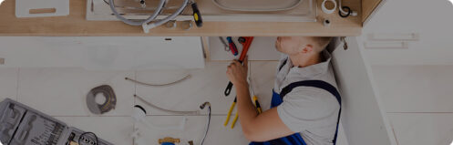 Plumber working on a residential sink