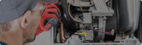 Technician repairing a furnace