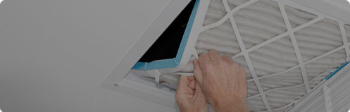 Person switching out an air filter