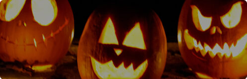 Row of scary Jackolantern pumpkins