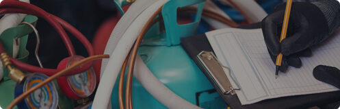 Technician inspecting HVAC freon