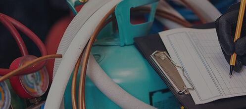 Technician inspecting HVAC freon