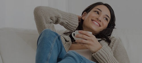 Pretty woman holding a cup of coffee in her Florida home