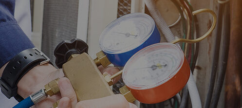 HVAC technician servicing an AC unit