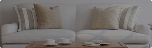 Pretty white couch and a wood coffee table